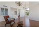 Open-concept living space with a lounge chair, high ceilings, and modern fixtures at 4020 E Laurel Ln, Phoenix, AZ 85028