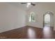 Spacious main bedroom with vaulted ceiling, wood floors, and ensuite bathroom at 4020 E Laurel Ln, Phoenix, AZ 85028