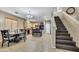 Charming kitchen and dining area featuring a breakfast bar, and modern appliances at 41369 W Parkhill Dr, Maricopa, AZ 85138