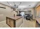 Spacious kitchen featuring stainless steel appliances, a center island and ample lighting at 41369 W Parkhill Dr, Maricopa, AZ 85138