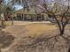 A large backyard with a covered patio, mature trees and low maintenance landscaping at 4172 E Graythorn Ave, Phoenix, AZ 85044