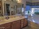 Spacious bathroom with double sinks, a large mirror, and a separate tub at 4172 E Graythorn Ave, Phoenix, AZ 85044