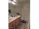 Functional bathroom offering double sinks, a bathtub and shower combination, and storage space at 4172 E Graythorn Ave, Phoenix, AZ 85044