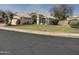 Charming single-story home with a well-manicured lawn and classic desert landscaping at 4172 E Graythorn Ave, Phoenix, AZ 85044