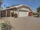 A well-maintained home featuring desert landscaping, a two-car garage and cozy curb appeal at 4172 E Graythorn Ave, Phoenix, AZ 85044
