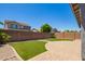 Large backyard with artificial turf, brick pavers, and desert landscaping at 4253 E Palo Verde St, Gilbert, AZ 85296