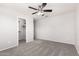 Bedroom with light walls, carpet, and a walk-in closet offers functional, comfortable space at 4253 E Palo Verde St, Gilbert, AZ 85296