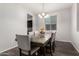 Dining room featuring hardwood floors, neutral colored walls, and a dark wood table at 4253 E Palo Verde St, Gilbert, AZ 85296