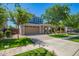Charming two-story home featuring a large garage, brick accents, and well-maintained landscaping at 4253 E Palo Verde St, Gilbert, AZ 85296
