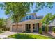 Charming two-story home with a well-manicured lawn, a two-car garage, and a brick-accented front porch at 4253 E Palo Verde St, Gilbert, AZ 85296