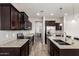 Well-equipped kitchen featuring granite countertops, tile backsplash, stainless steel appliances, and an island at 4253 E Palo Verde St, Gilbert, AZ 85296