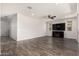 Expansive living room featuring wood-look floors, recessed lighting, and modern decor with a ceiling fan at 4253 E Palo Verde St, Gilbert, AZ 85296