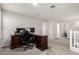 Spacious carpeted loft area with a built-in desk and chair, creating a perfect home office space at 4253 E Palo Verde St, Gilbert, AZ 85296