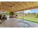 Covered backyard patio with ceiling fan offering outdoor entertaining space and backyard views at 4332 W Monte Cristo W Ave, Glendale, AZ 85306