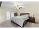 Cozy bedroom featuring a ceiling fan, neutral walls, and a sliding glass door at 4332 W Monte Cristo W Ave, Glendale, AZ 85306