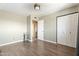 Bedroom with hardwood floor, closet, and a doorway at 4332 W Monte Cristo W Ave, Glendale, AZ 85306