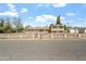 Attractive home showcasing a well-maintained yard, distinctive brick accents, and a decorative fence at 4332 W Monte Cristo W Ave, Glendale, AZ 85306
