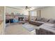Comfortable living room featuring a fireplace and a plush, gray sectional sofa at 4332 W Monte Cristo W Ave, Glendale, AZ 85306