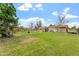 Sprawling grassy backyard with sheds and horse enclosure at 4332 W Monte Cristo W Ave, Glendale, AZ 85306