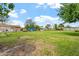 View of the grassy backyard featuring sheds and a horse enclosure at 4332 W Monte Cristo W Ave, Glendale, AZ 85306