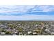 Expansive aerial view of homes in a vibrant neighborhood showcasing mountain views and the vast city skyline at 4440 E Campbell Ave, Phoenix, AZ 85018