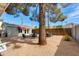 Relaxing backyard with gravel, patio set, and mature trees providing shade and a tranquil setting at 4440 E Campbell Ave, Phoenix, AZ 85018