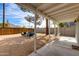 Charming covered patio with comfortable seating overlooking a pea gravel yard, ideal for relaxation and outdoor enjoyment at 4440 E Campbell Ave, Phoenix, AZ 85018
