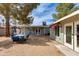 Charming backyard with gravel, cozy seating area, and well-maintained landscaping, perfect for outdoor entertaining at 4440 E Campbell Ave, Phoenix, AZ 85018