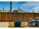 Relaxing backyard seating area with mountain views and a wooden fence providing privacy and charm at 4440 E Campbell Ave, Phoenix, AZ 85018