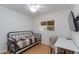 Well-lit bedroom featuring a desk, ceiling fan, and natural light at 4440 E Campbell Ave, Phoenix, AZ 85018