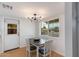 Cozy dining room features modern light fixture, wood floors, and ample natural light at 4440 E Campbell Ave, Phoenix, AZ 85018