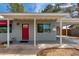 Inviting front exterior featuring a red door, covered entry, and well-maintained landscaping at 4440 E Campbell Ave, Phoenix, AZ 85018