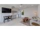 Multi-purpose living space featuring a kitchenette, comfortable seating, and a dining area at 4440 E Campbell Ave, Phoenix, AZ 85018
