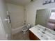 Bathroom with a shower-tub combo, toilet, vanity, mirror, and tiled floors at 46037 W Starlight Dr, Maricopa, AZ 85139
