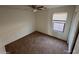 Cozy bedroom featuring carpet flooring, a window, and a closet at 46037 W Starlight Dr, Maricopa, AZ 85139