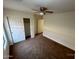 Bedroom featuring carpet flooring, a ceiling fan, and a closet at 46037 W Starlight Dr, Maricopa, AZ 85139