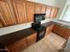 Well-equipped kitchen featuring ample wooden cabinets, countertops, and modern appliances at 46037 W Starlight Dr, Maricopa, AZ 85139