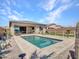 Private backyard pool with desert landscaping and a patio area perfect for entertaining at 5581 N 206Th Ave, Buckeye, AZ 85396