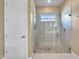 Beautiful glass enclosed shower with custom tile work, a window, and a built-in shower head at 5581 N 206Th Ave, Buckeye, AZ 85396