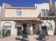 Backyard patio with lounge chairs, dining set, desert plants, and umbrella, perfect for relaxing outdoors at 6144 S Fairway Pl, Gold Canyon, AZ 85118