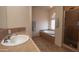 This bathroom features a stand-up shower, large tub, neutral decor, and good natural light at 6144 S Fairway Pl, Gold Canyon, AZ 85118