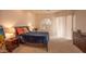 This bedroom offers neutral decor, carpet flooring, and a large window for natural light at 6144 S Fairway Pl, Gold Canyon, AZ 85118
