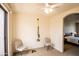 This bonus room is outfitted with exercise equipment and a ceiling fan for added comfort at 6144 S Fairway Pl, Gold Canyon, AZ 85118