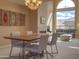 Living and dining area featuring a fireplace and large window with scenic views at 6144 S Fairway Pl, Gold Canyon, AZ 85118