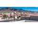 Beautiful view of homes with mountain backdrop, desert landscaping, and red tile roofs at 6144 S Fairway Pl, Gold Canyon, AZ 85118