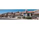 View of multiple attached townhomes with desert landscaping, tile roofs, and garages at 6144 S Fairway Pl, Gold Canyon, AZ 85118