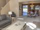 Open-concept living room with view of kitchen, and sliding glass doors to a patio at 6144 S Fairway Pl, Gold Canyon, AZ 85118