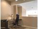 This office space features an adjustable desk, rolling chair, and neutral decor at 6144 S Fairway Pl, Gold Canyon, AZ 85118