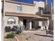 Spacious patio area with desert landscaping, an umbrella and outdoor seating perfect for entertaining at 6144 S Fairway Pl, Gold Canyon, AZ 85118