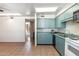 Charming kitchenette featuring classic appliances and tile flooring offering cozy cooking space at 6928 E 3Rd St, Scottsdale, AZ 85251